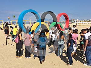 People taking picutres at olympic arcs - Rio 2016