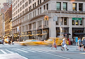 People and taxis in the intersection of Fifth Avenue and 23rd in New York City