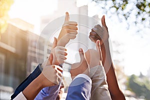 People, thumbs up and diversity with business success outdoor for agreement, teamwork and lens flare. Global group