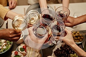 People toasting with glasses of wine