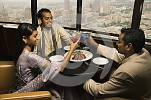 People Toasting in Restaurant