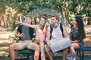 People tourists searching for direction using paper map