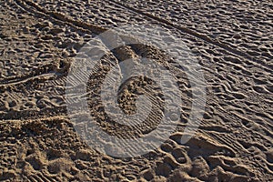 People trampled sand on the Mediterranean Sea beach