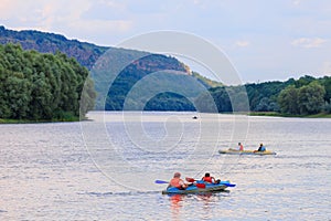 People travel along the river in a kayak. Rafting as a healthy lifestyle. Background