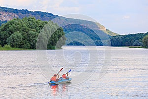 People travel along the river in a kayak. Rafting as a healthy lifestyle. Background