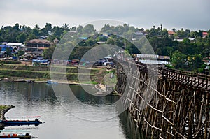 People travel and walk on Saphan Mon wooden bridge in morning ti