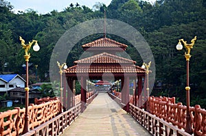 People travel and walk on Saphan Mon wooden bridge in morning ti