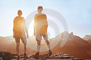 Travel, people traveling, hiking in mountains, couple of hikers looking at panoramic landscape