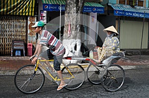 People on the tricycle in Chaudok, Vietnam
