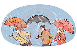 People with umbrellas under rain