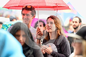 People with umbrellas watching a concert under the rain at Heineken Primavera Sound 2014 Festival