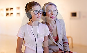 People using audio guide in museum
