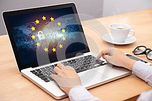 People using computer laptop with text GDPR or General Data Protection Regulation secure , star and padlock logo on monitor screen