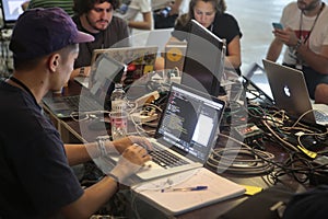 People using laptops on coworking area