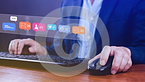 People using touching social media and digital online marketing concepts on laptop with icons such as notifications, messages,
