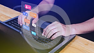 People using touching social media and digital online marketing concepts on laptop with icons such as notifications, messages,