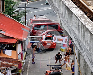 People with vehicles on street in Manila, Philippines