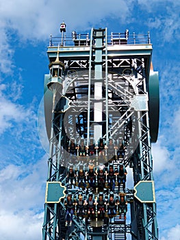 People in the carriage at vertical drop of dive coaster
