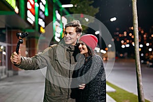 People Video Blogging On Camera On Street. Couple Taking Photos