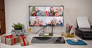 People on video call with family celebrating virtual christmas holidays together online