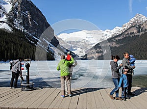 Tourists on banks of Lake Louise, Alberta, Canada