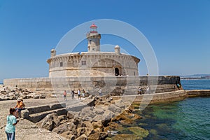 People visiting the old Bugio Lighthouse