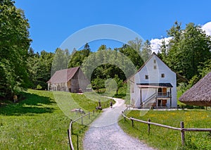 People visiting the old farm house in Ballenberg. Swiss Open Air Museum in Brienz, Switzerland