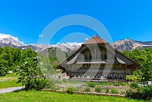 People visiting the old farm house in Ballenberg. Swiss Open Air Museum in Brienz, Switzerland