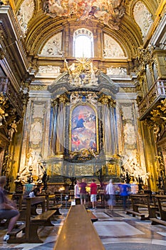 People visiting and praying in Chiesa del Gesu photo