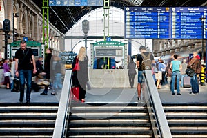 People wait for the trains on railway station