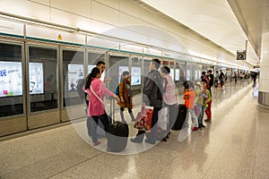 People waiting for a Airport Express train