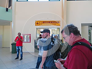 People waiting in  line at the Holguin Airport to exchange their currency