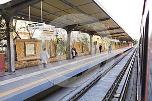 People waiting for the local train on Kato Petralona