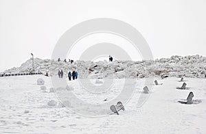 People walk near pressure ridges. Zelenogorsk St Petersburg. Russia