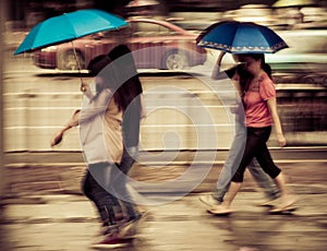 People walk on road in rainy day