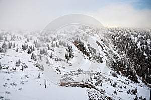 People walk in snowy winter mountains country, Krkonose, freezing weather