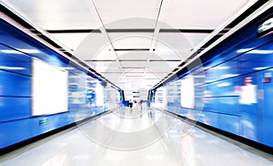 People walk in subway tunnels