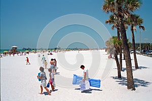 People walking along beach