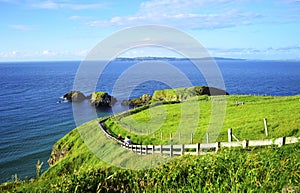 People Walking Along the Coastline Footpath to Carrick-a-Rede Rope Bridge