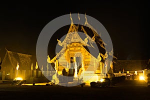 People walking around church in triple circumambulation ceremony photo