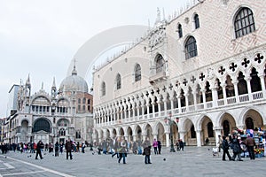 People walking around the Doge`s Palace and San Marco Basilica, Venice, Italy