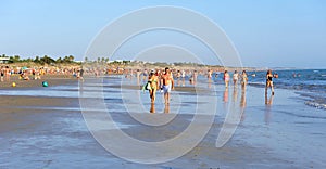 People walking on the beach Costa Ballena, Cadiz province, Spain