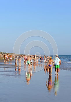 People walking on the beach Costa Ballena, Cadiz province, Spain