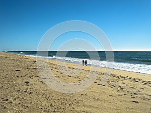 People are walking on the beach of Faro