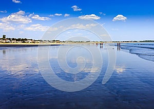 People Walking on the beach at Pine Point Maine