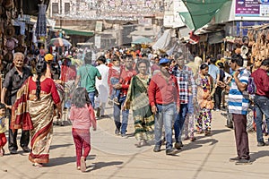 People walking in a busy road in the street market in holy city Pushkar, Rajasthan, India