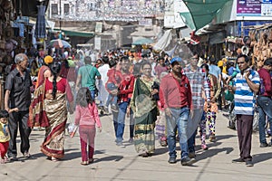 People walking in a busy road in the street market in holy city Pushkar, Rajasthan, India
