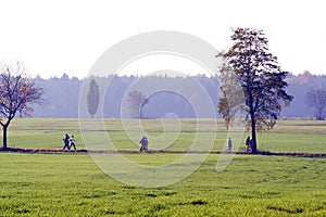 People walking through countryside.