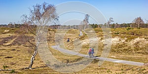 People walking through the dunes of the national park Drents-Friese Wold photo