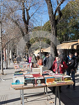 People walking and flipping through books Antique Book Store in